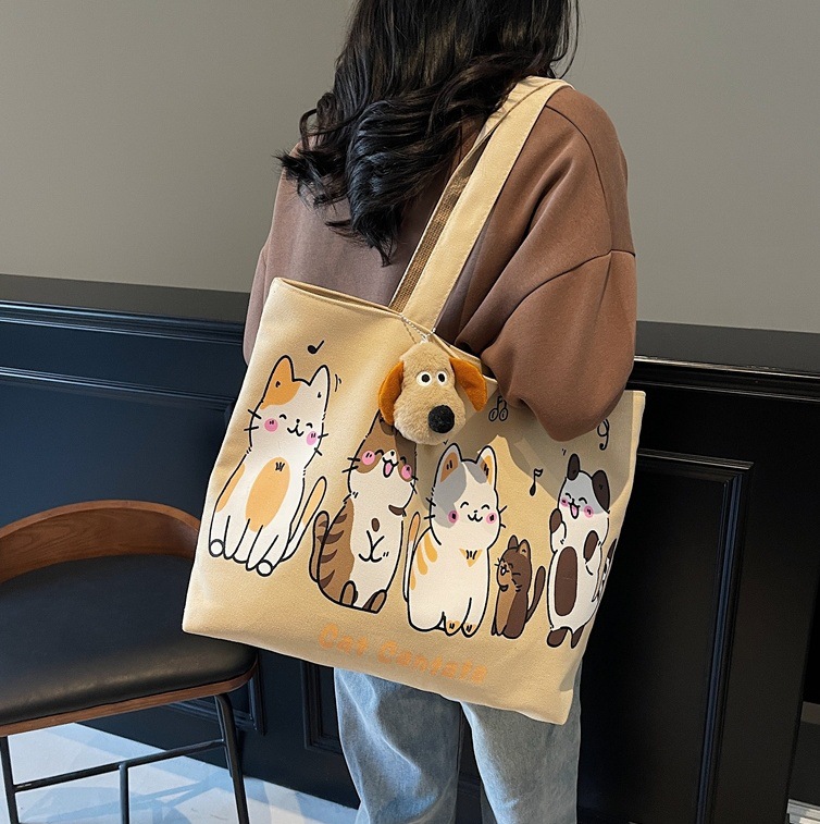 Spring 2025 new ins laid-back style large-capacity canvas bag, versatile single-shoulder student artistic cartoon tote bag full figure