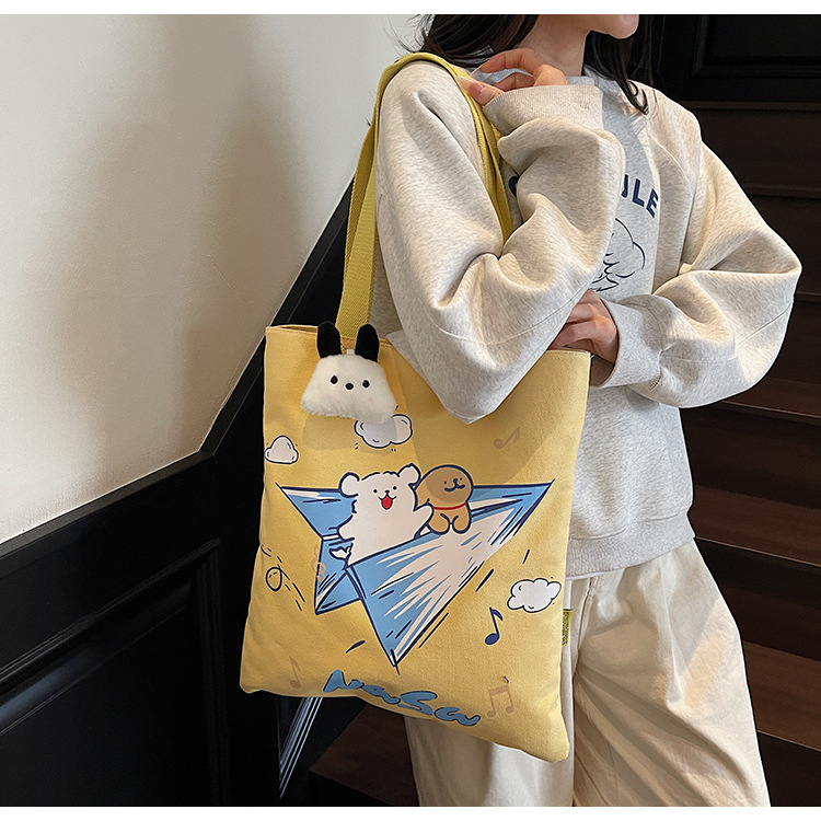 New canvas bag, student cartoon, artistic, large-capacity handbag, single-shoulder, versatile, hand-held schoolbag, commuter handbag full figure