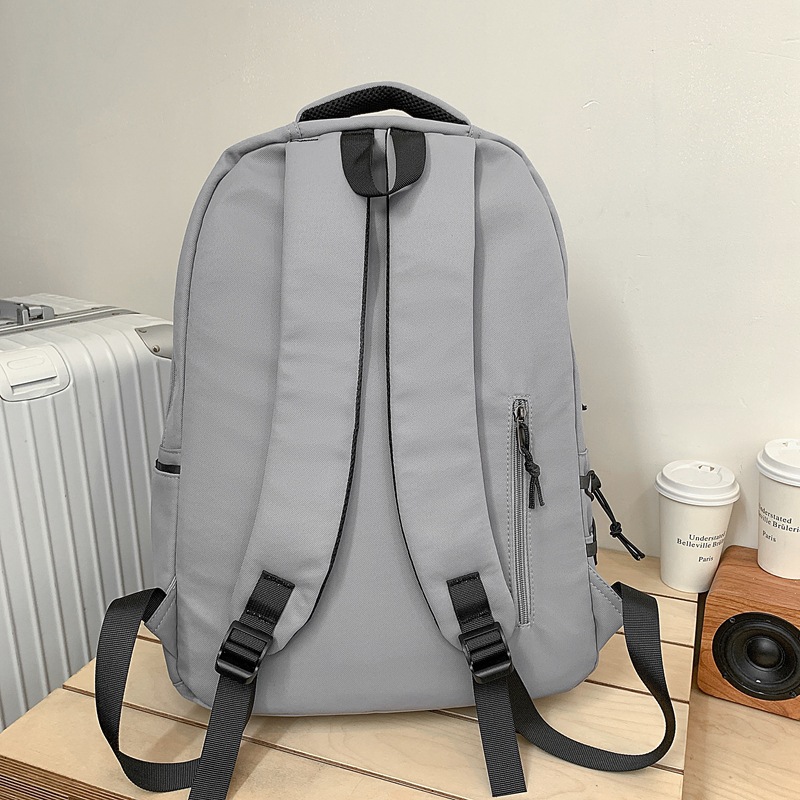 New large-capacity, simple and trendy college student couple computer bag, sturdy and durable middle school student backpack Application Scenario