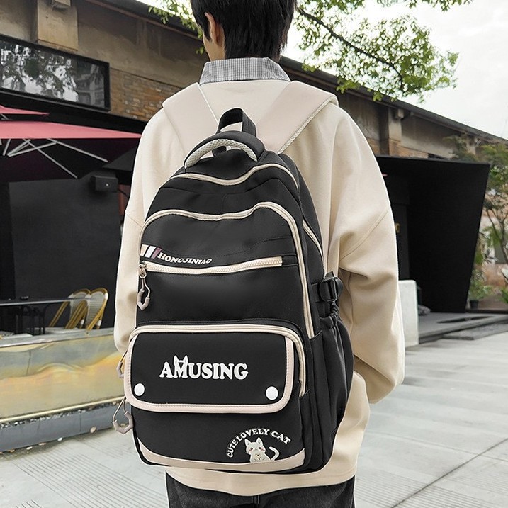 A new Korean-style college student couple casual backpack with a high appearance level. It is a multi-layered backpack for teenagers and students full figure