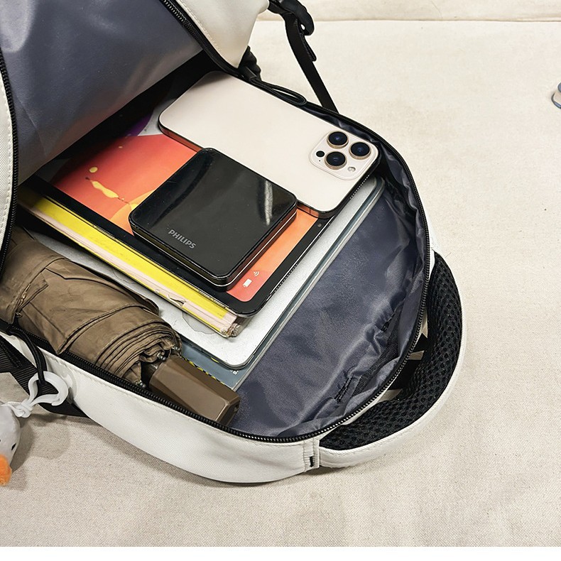 New minimalist color-blocking couple crossbody bag, high appearance level, casual large-capacity two-piece backpack for primary and secondary school students Application Scenario