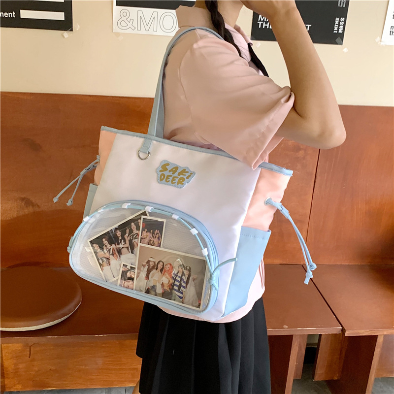 The new Japanese-style, fresh and cute transparent "baji" bag is a casual, simple and lightweight commuting crossbody bag for junior and senior high school students full figure