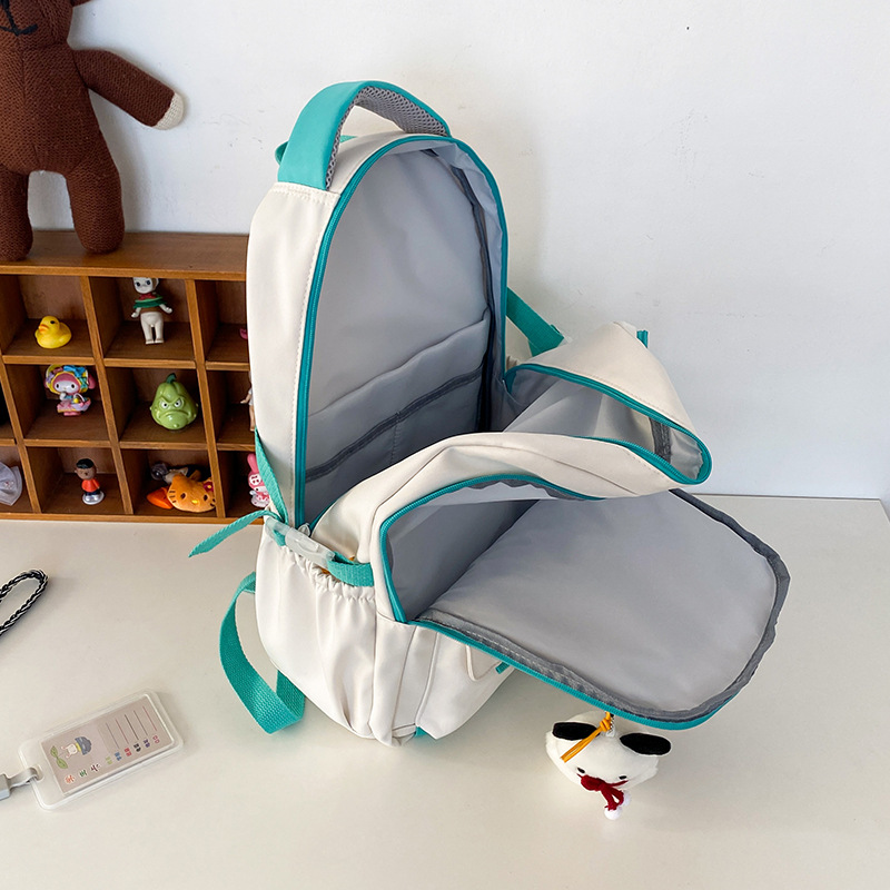 New Japanese-style ins high-appearance-level primary school student embroidered backpacks and large-capacity color-blocking middle school student backpacks Application Scenario