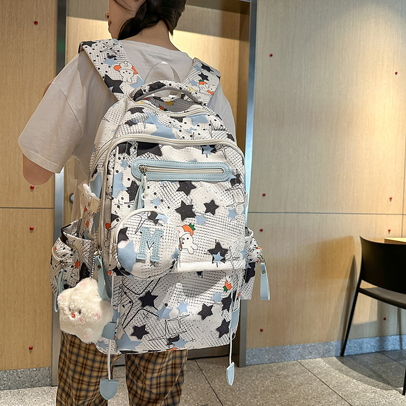 The new high-appearancelevel five-pointed star ins backpack is a casual, simple, fashionable and versatile large-capacity backpack for junior and senior high school students details Picture