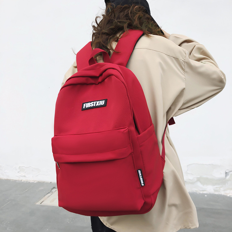 Schoolbag for girls, junior high school, senior high school and college students, solid color simple style backpack, 2023 new Korean version lightweight and niche backpack full figure