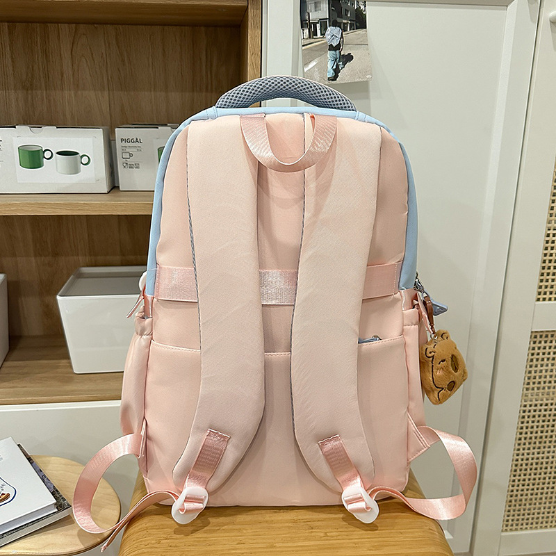 A new high-appeal, fresh and sweet macaron-colored cute puppy backpack for junior and senior high school students, a color-matched lightweight backpack Specification drawing