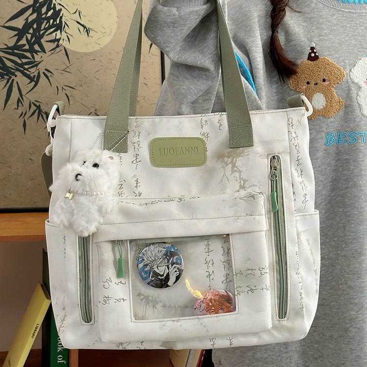 New single-shoulder bag with a national trend style, a storage bag for primary school students' classes, a new Chinese artistic style transparent pain bag, and a crossbody bag full figure