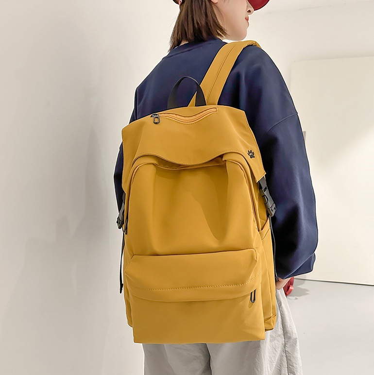 The 2025 new large-capacity simple backpack has a high appearance level. It is suitable for both boys and girls and is a solid color schoolbag for junior and senior high school students full figure