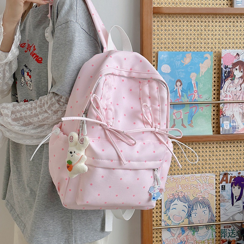 This is an Instagram-style, niche, and highly attractive polka dot Korean-style backpack for young girls. It is lightweight and a travel backpack for junior high school and college students details Picture