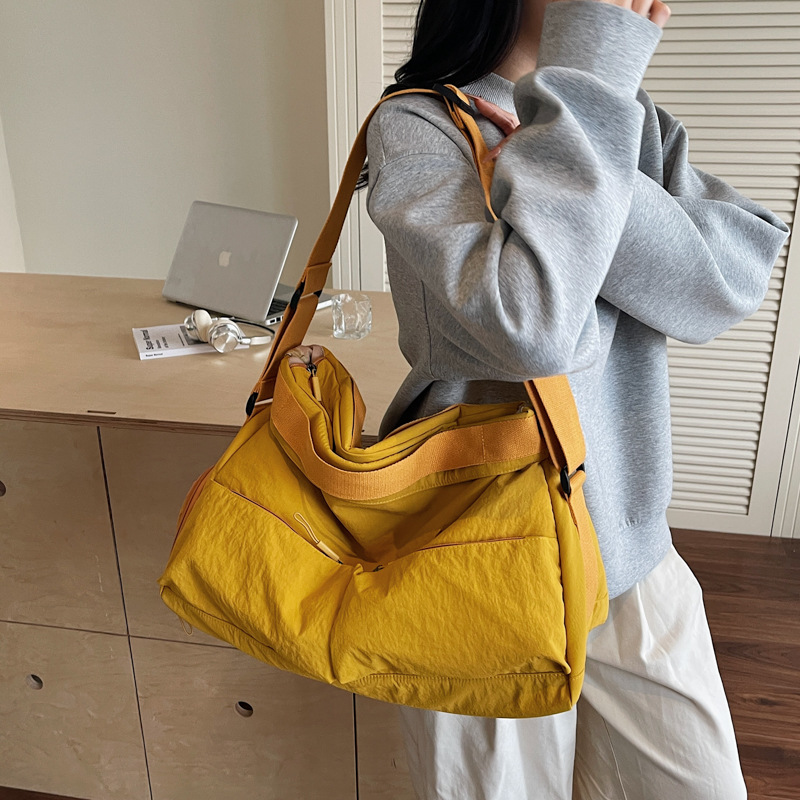 A new Korean-style ins tote bag with a high level of appearance, fresh and sweet, candy-colored, lightweight storage, and a crossbody bag for travel and shopping full figure