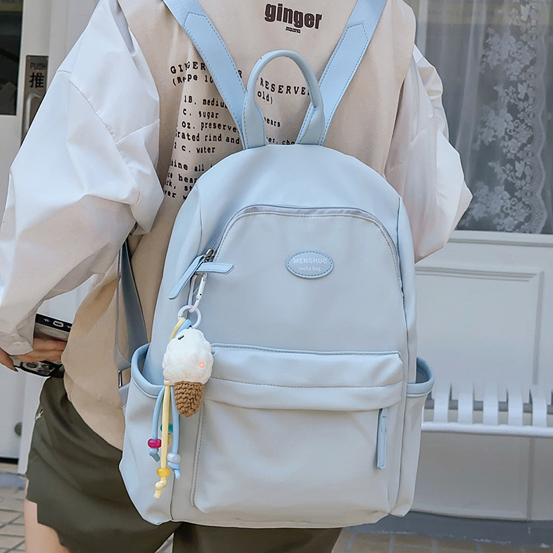 A new Japanese-style ins fresh and sweet candy-colored backpack, a simple and large-capacity backpack in solid colors for junior and senior high school students full figure