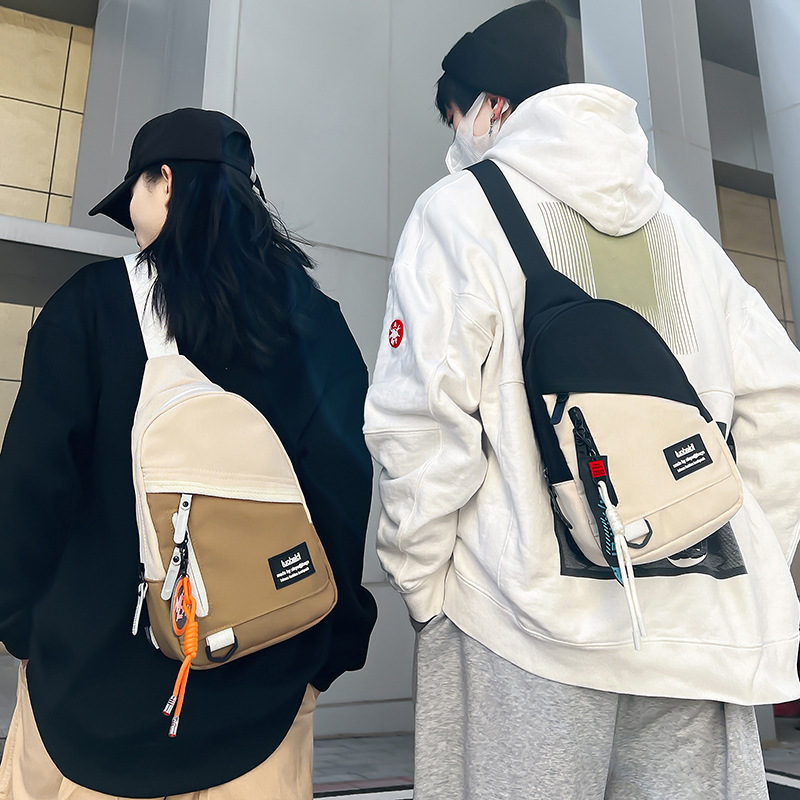 A new high-look, trendy and cool Japanese-style crossbody bag for both men and women, a casual, simple and versatile, lightweight, color-block chest bag details Picture