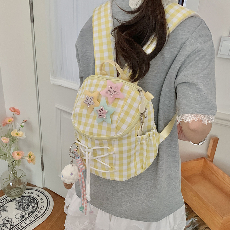 A new high-appeal, fresh, sweet and cute mini backpack with a checkered pattern for junior and senior high school students, a lightweight backpack for their travels details Picture