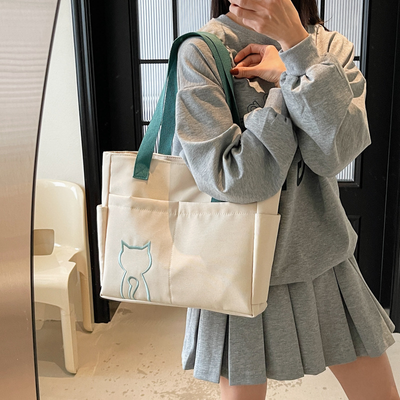 New summer Korean-style lightweight color-blocking hand-held canvas bag, casual and versatile shoulder bag, simple commuting tote bag details Picture