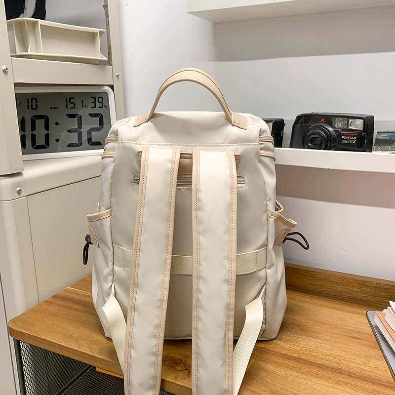 2025 New casual large-capacity versatile backpack, lightweight and fashionable commuting travel backpack, niche solid-color schoolbag Specification drawing