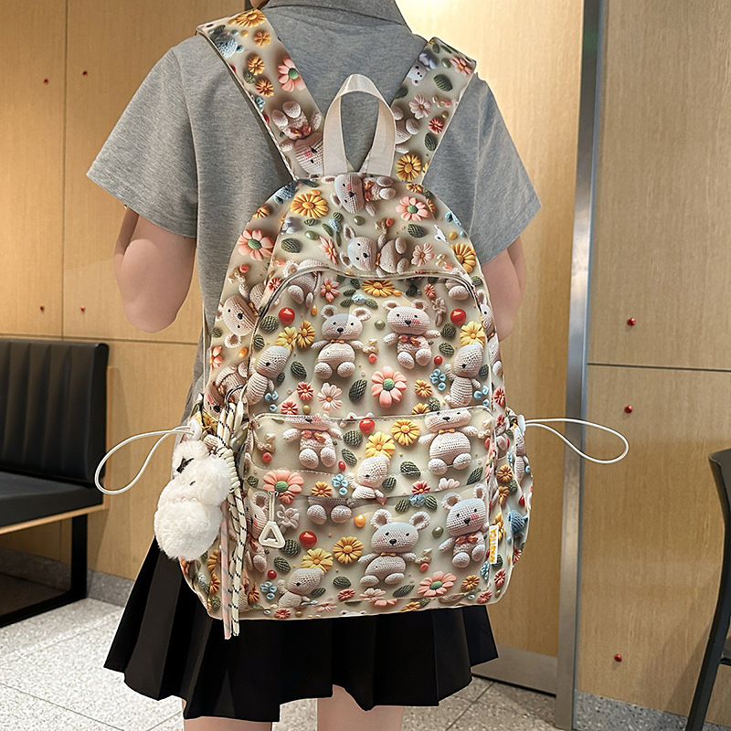 A new high-appeal, fresh, sweet and cute printed backpack for junior and senior high school students, a lightweight and large-capacity backpack for after-school tutoring full figure