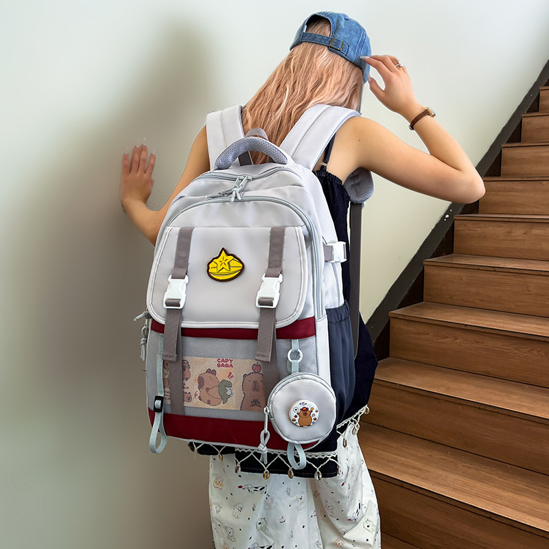 The new Korean version of the ins high-appeartion-level college style color-blocking and patchwork backpack is a large-capacity backpack for students in grades 1-3 full figure