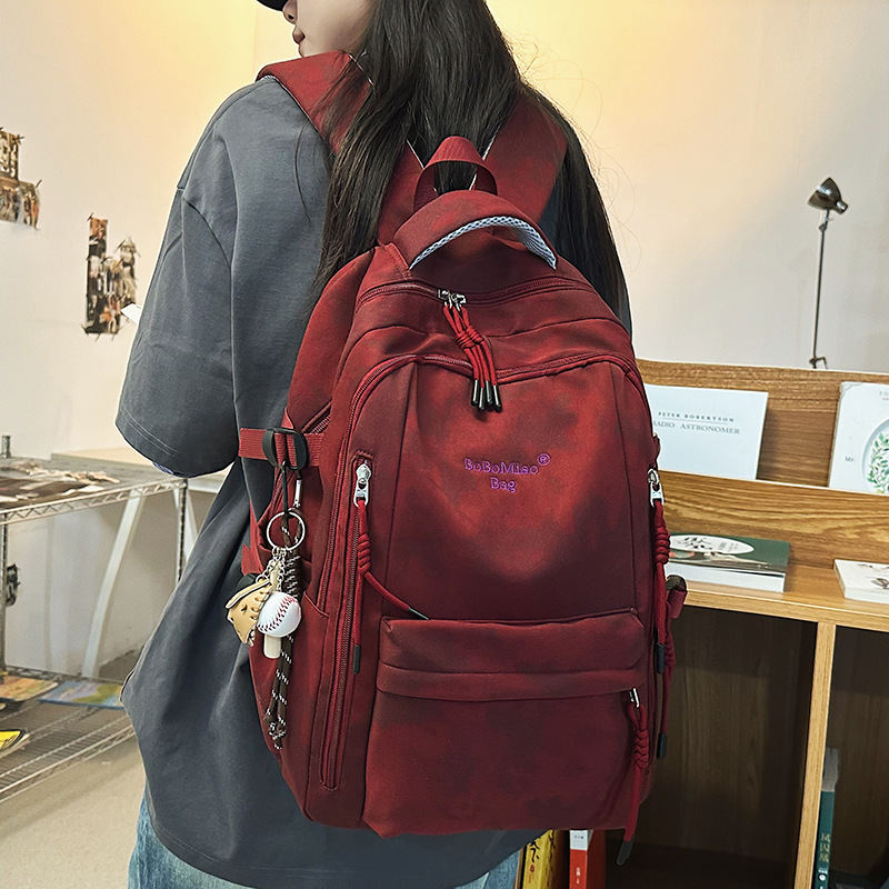 Large-capacity dark-patterned gradient color schoolbag for junior high school girls, high school and college students, light travel backpack for boys full figure