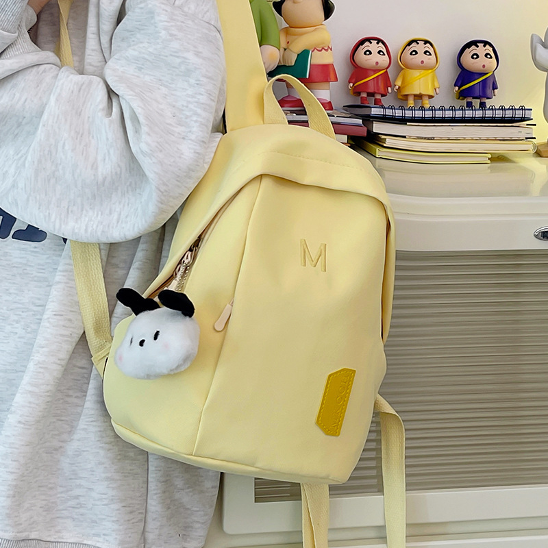 A simple and cute female college student's small backpack for shopping and attending classes. A cute mini backpack for children's spring outing full figure