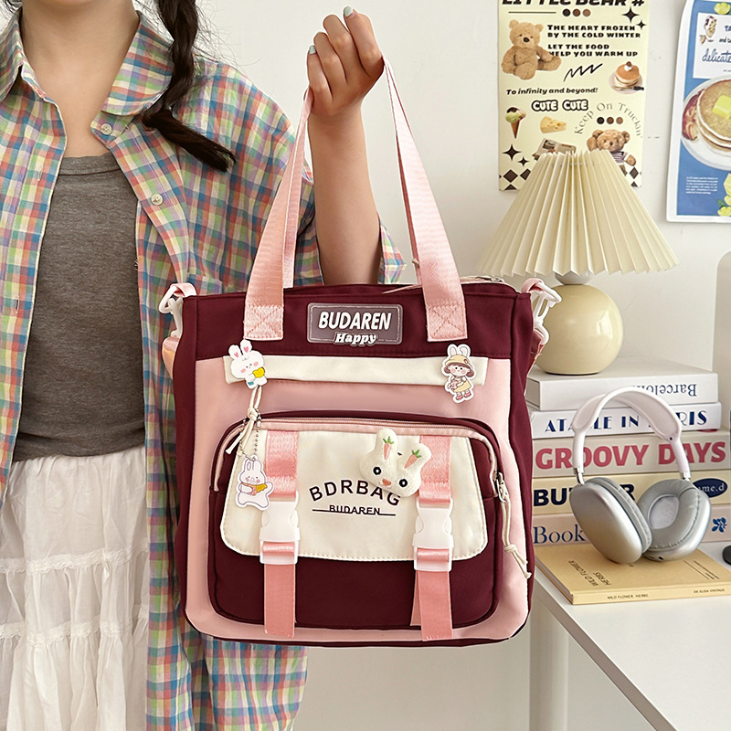A color-blocking, versatile, high-appeartion-level crossbody bag for women, a new forest-themed tote bag for primary school students, a cute and lightweight after-school bag details Picture