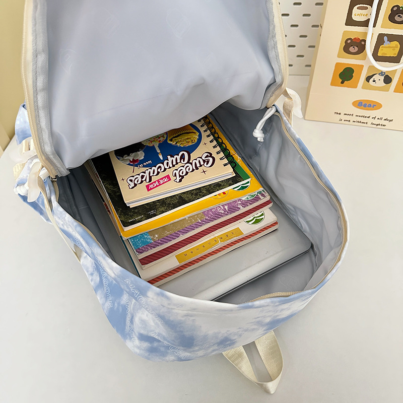 A new high-appeal, fresh and niche tie-dyed schoolbag for junior and senior high school students, featuring multiple pockets and large capacity Application Scenario