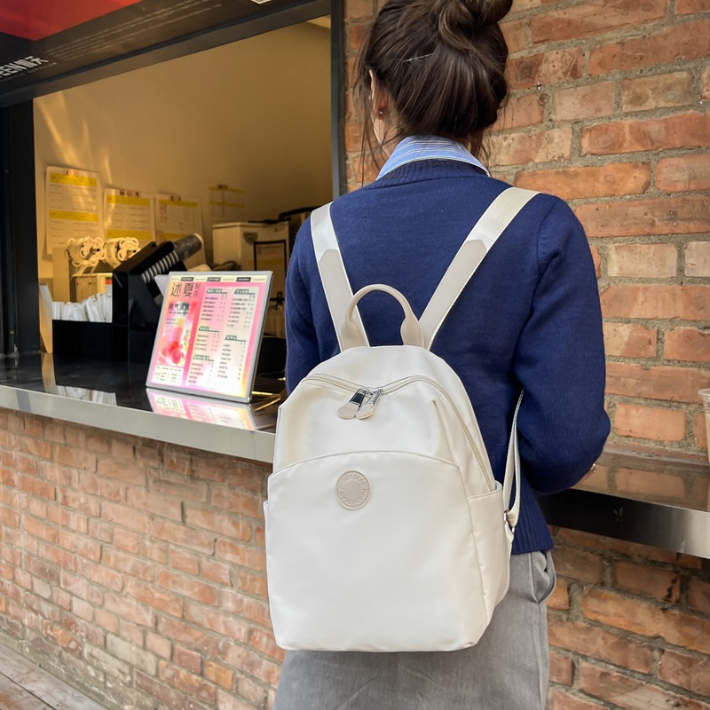 A niche and high-end large-capacity backpack, a lightweight travel and casual backpack, versatile and fashionable forest-themed hand-held schoolbag full figure