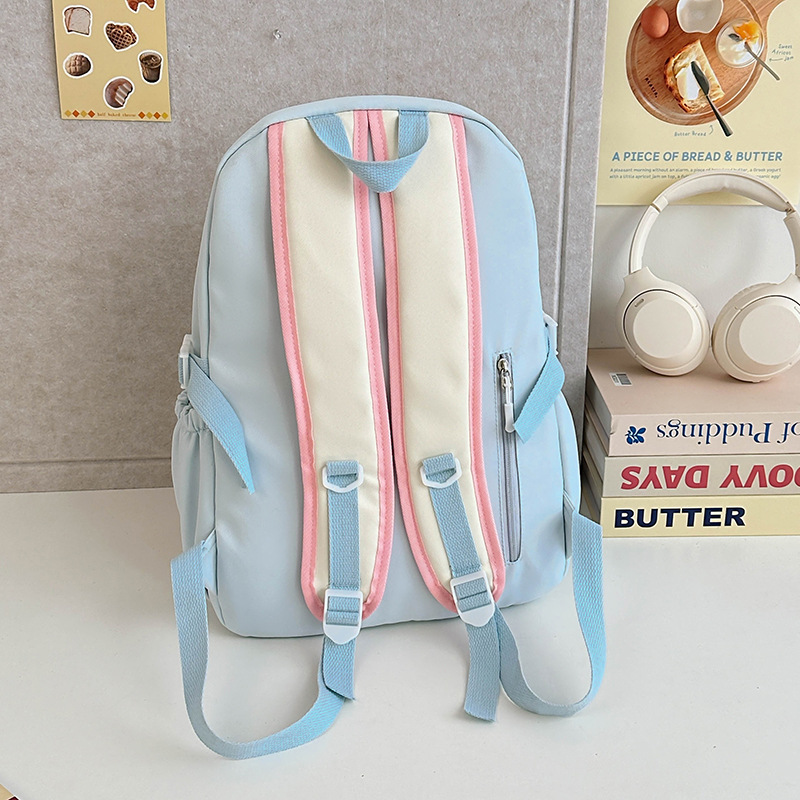 This is a fresh and cute backpack for children and primary school students in grades 3 to 6. It features a sweet style with a contrasting color and a transparent layer Specification drawing