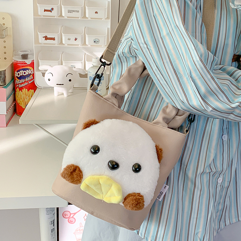 This cute plush crossbody bag is a versatile new casual handbag for children. It features a cartoon shoulder bag with storage space and an Ins-style backpack details Picture