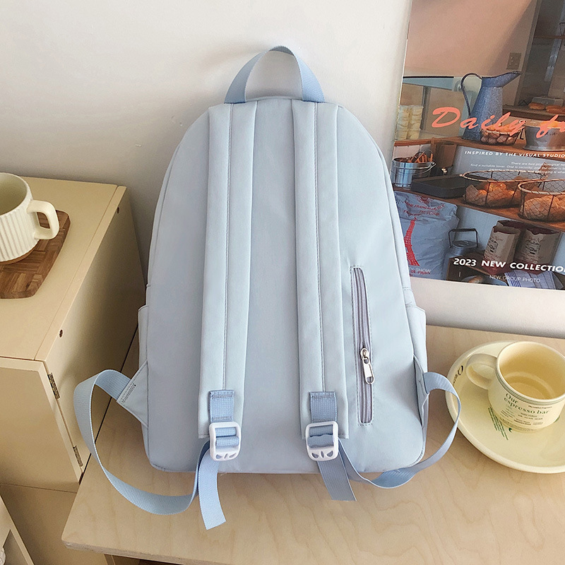 A new Japanese-style ins backpack with a high level of appearance, fresh and sweet color contrast, is a lightweight multi-pocket backpack for primary and secondary school students Specification drawing