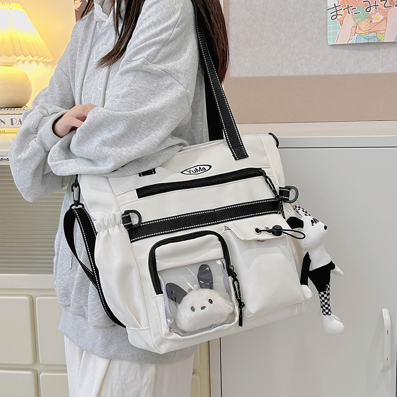 Large-capacity student tutorial bags, hand-carried bags, junior and senior high school students, college students, high appearance level, single-shoulder crossbody bags, women full figure