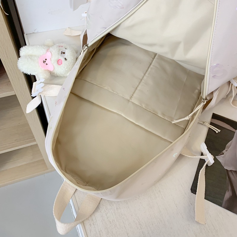 College student graffiti reflective simple schoolbag, versatile casual backpack, large-capacity Hansen series high appearance level backpack Application Scenario