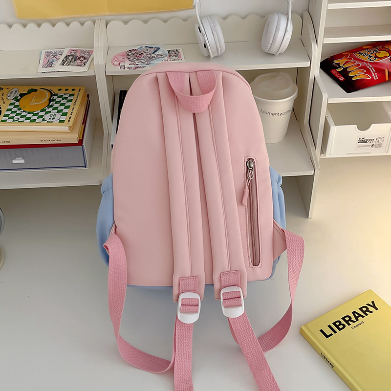 A small backpack for children's spring outing and study tour, a Japanese-style Instagram sweet color contrast forest-style mini backpack for girls' travel and shopping Application Scenario
