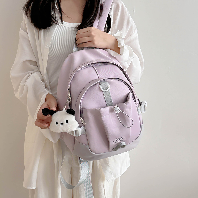 The Korean version of the ins color-blocking soft girl mini backpack is soft, cute and sweet. It's a mini backpack for children's outings full figure