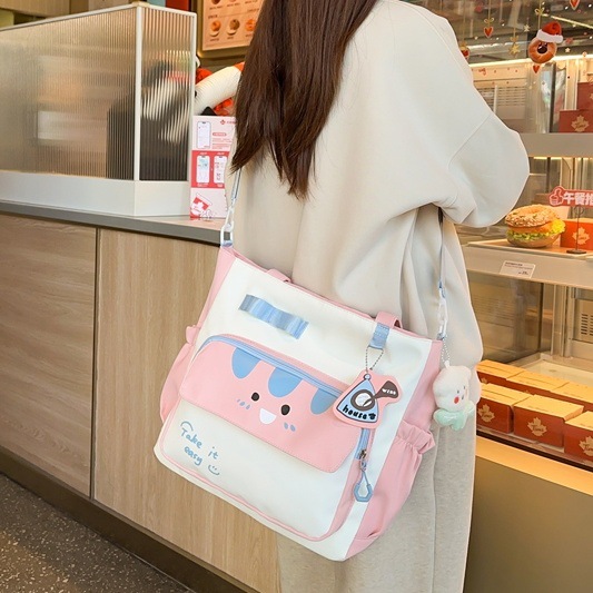 2025 New cute large-capacity tutorial bag, primary school single-shoulder bag, handbag, tutorial bag, crossbody art schoolbag full figure