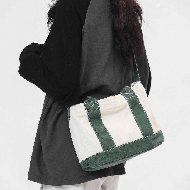 A simple and stylish Japanese Instagram casual canvas single-shoulder bag, a literary and artistic hand-held crossbody bag for a girl's outing details Picture