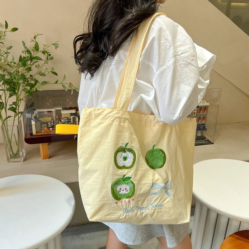 2025 New large-capacity tutorial bag, student fashion and cute single-shoulder bag, cartoon embroidery style drawstring underarm bag full figure