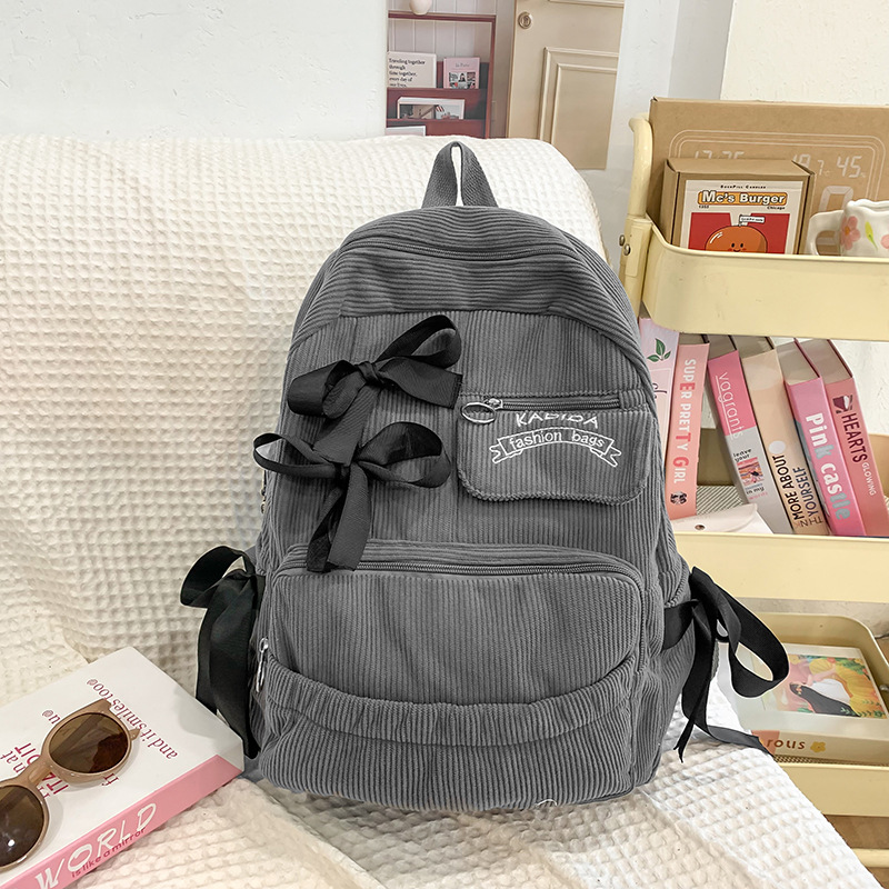 Ins-style bow schoolbag, corduroy for girls, popular backpack for junior high school and primary school students, large-capacity niche backpack details Picture