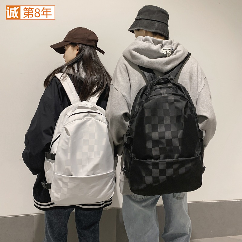 New large-capacity checkerboard checkered college student couple backpack, Korean version Instagram trendy sports backpack full figure