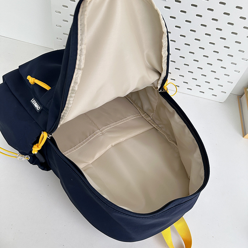 Korean-style simple solid-color letter student computer backpack, lightweight and large-capacity travel backpack, versatile and casual backpack Application Scenario