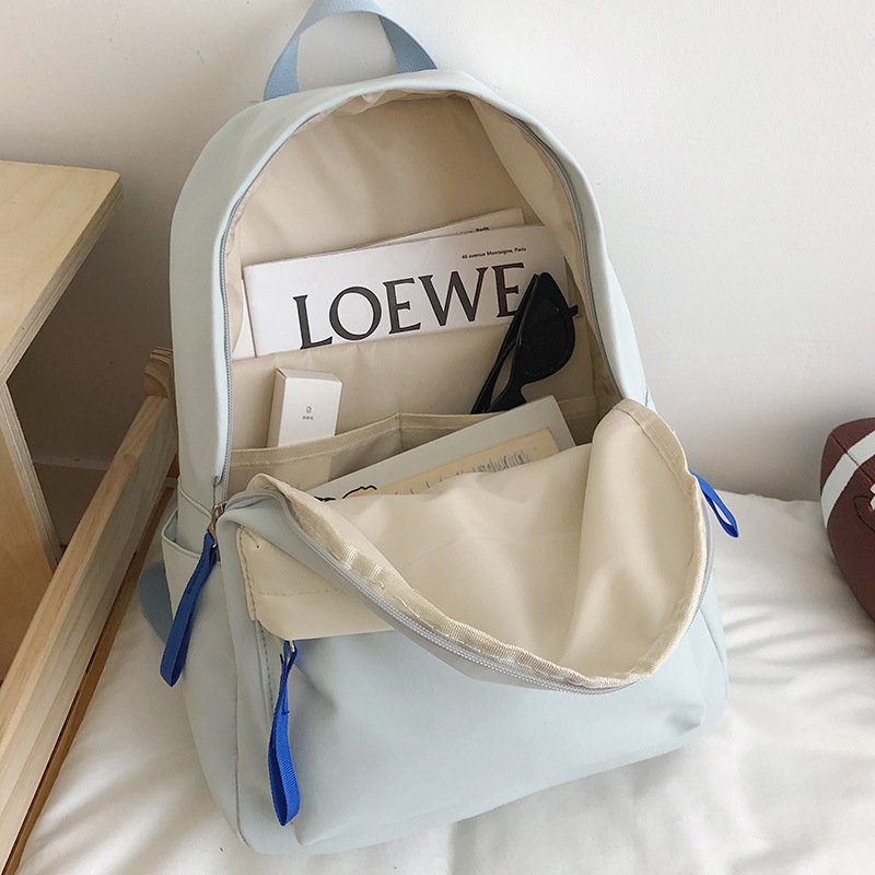A new Japanese-style ins backpack with a high level of appearance, fresh and sweet color contrast, is a lightweight multi-pocket backpack for primary and secondary school students Application Scenario