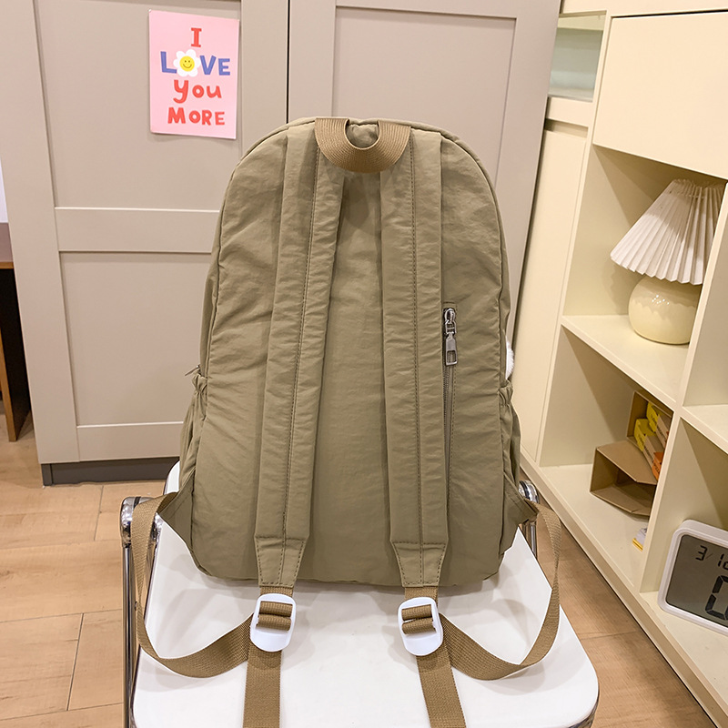 The ins backpack is a niche design backpack for female college students with a simple and solid color. It is a Korean-style travel backpack for junior and senior high school students Specification drawing