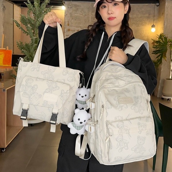 Schoolbag for female primary school students, high appearance level, large capacity backpack for grades three to six, cute graffiti, middle school student backpack full figure