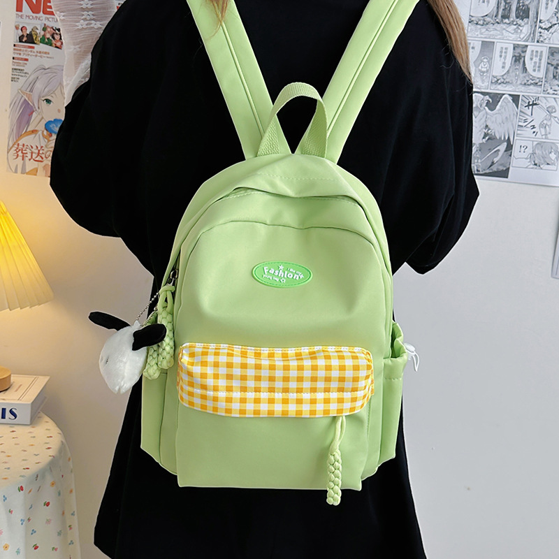 A new fresh and sweet candy-colored checkered backpack from Japanese ins, a casual and lightweight shopping backpack for junior and senior high school students details Picture