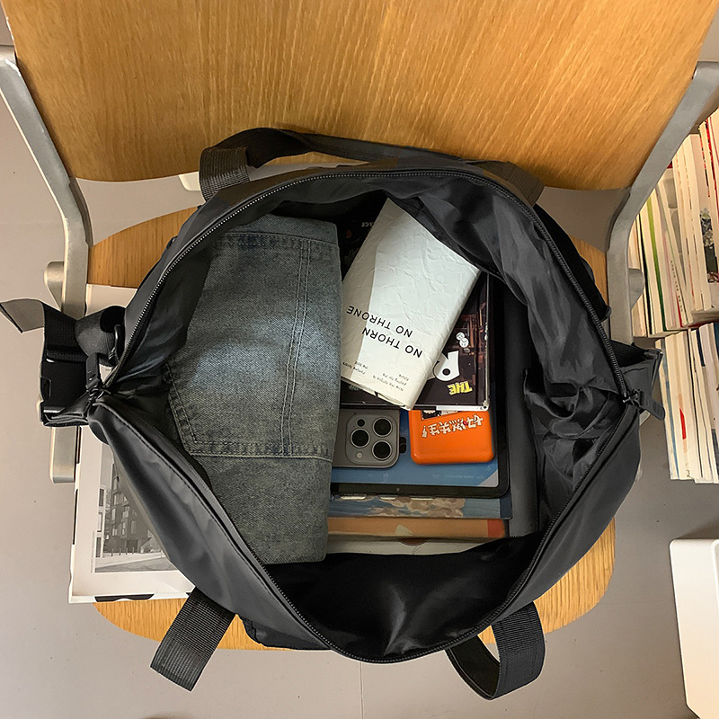 A new large-capacity, fashionable and versatile men's hand-held travel bag with Korean ins letter print casual sports crossbody Application Scenario