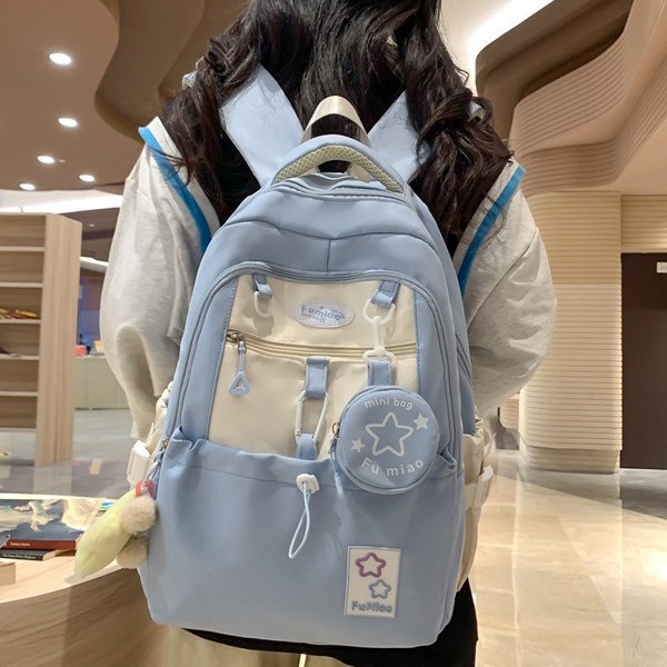 A new Korean-style backpack with a high level of appearance, fresh and sweet college style, and a large-capacity backpack with color-blocking and splicing for junior and senior high school students full figure