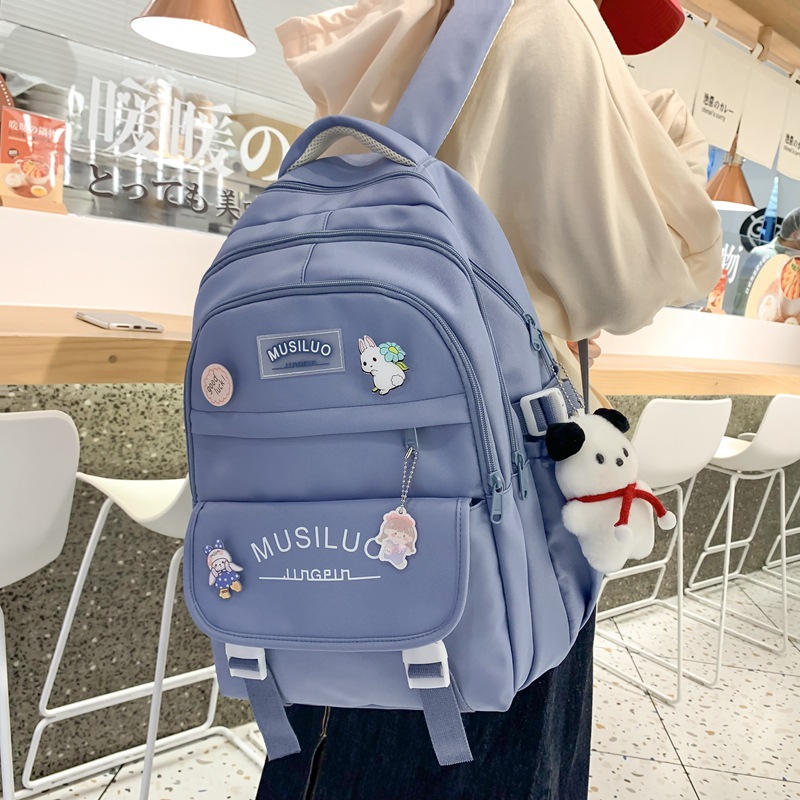 This is a large-capacity backpack for middle school students in grades three to six with an ins style Korean schoolbag details Picture