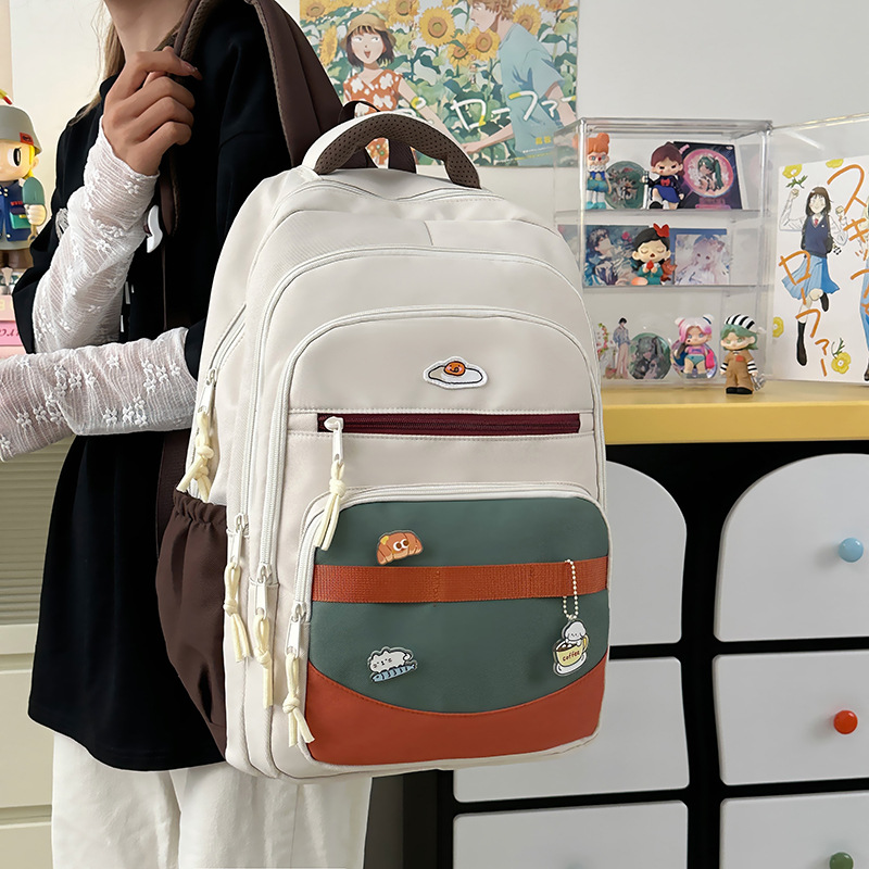 The new forest-themed ins high-appearance-level fresh and sweet backpack for junior and senior high school students features color-blocking and large-capacity backpacks full figure