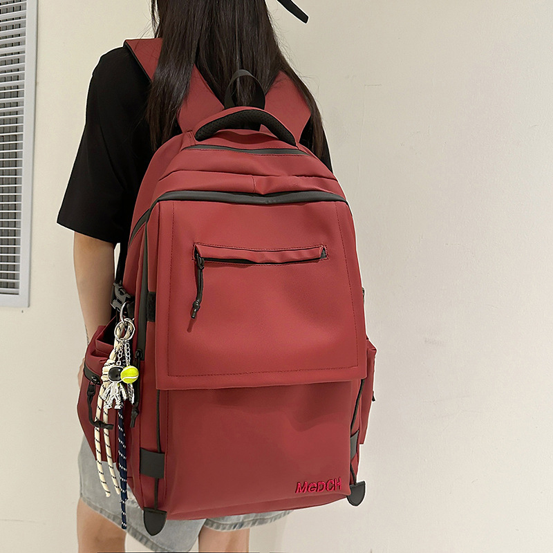 A new high-appearancelevel solid-color simple backpack from Korean Instagram, a couple's lightweight travel and mountaineering backpack with large capacity details Picture