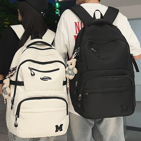 A new Japanese-style Instagram niche design solid-color simple backpack for couples, a casual and lightweight travel and hiking backpack full figure