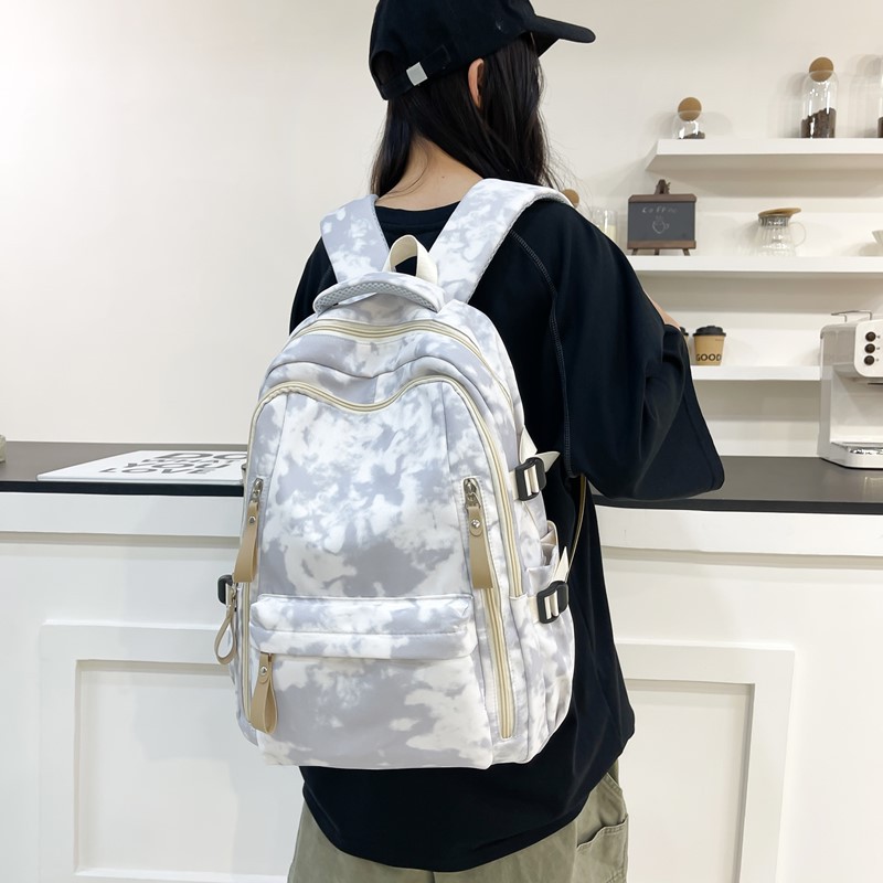A new high-appearance-level, fresh and sweet tie-dyed backpack for junior and senior high school students, which is light, simple and has a large capacity details Picture